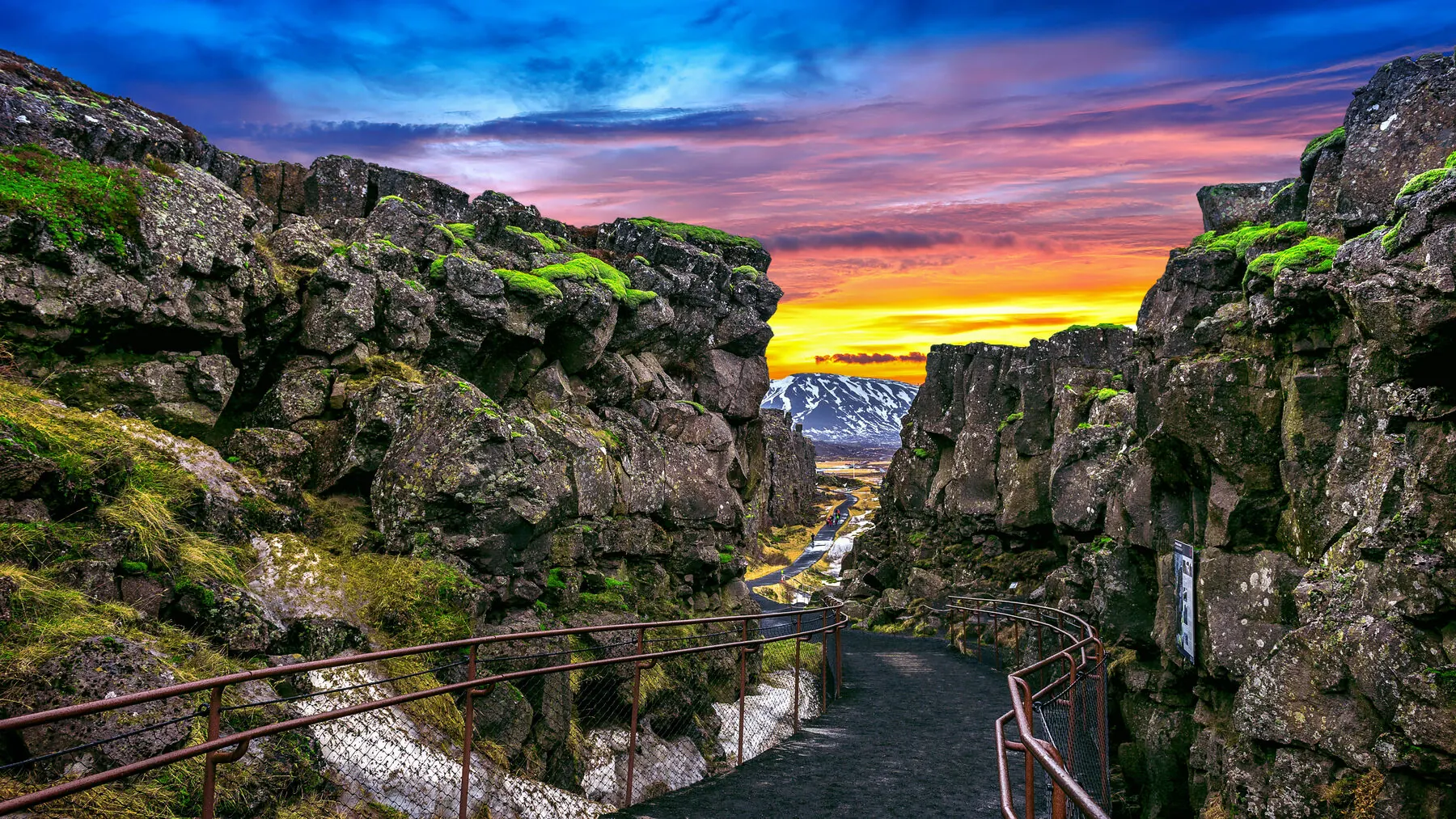 The rift valley at Þingvellir National Park under a colourful sunset sky