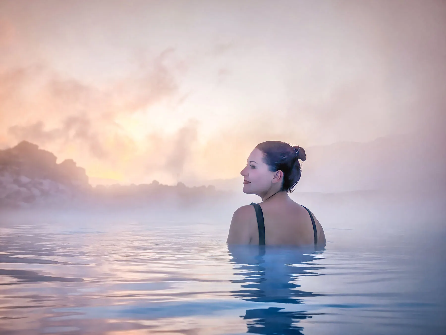 Geothermal lagoon glowing in golden-hour light